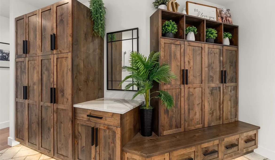 Custom built-in wood cabinetry with bench seating and integrated storage in Olympia, WA entryway