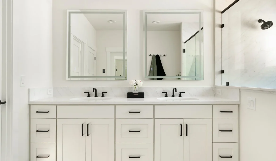 Primary bathroom with quartz slab shower, Kohler fixtures, and custom cabinetry at Sound View Estate in Olympia, WA