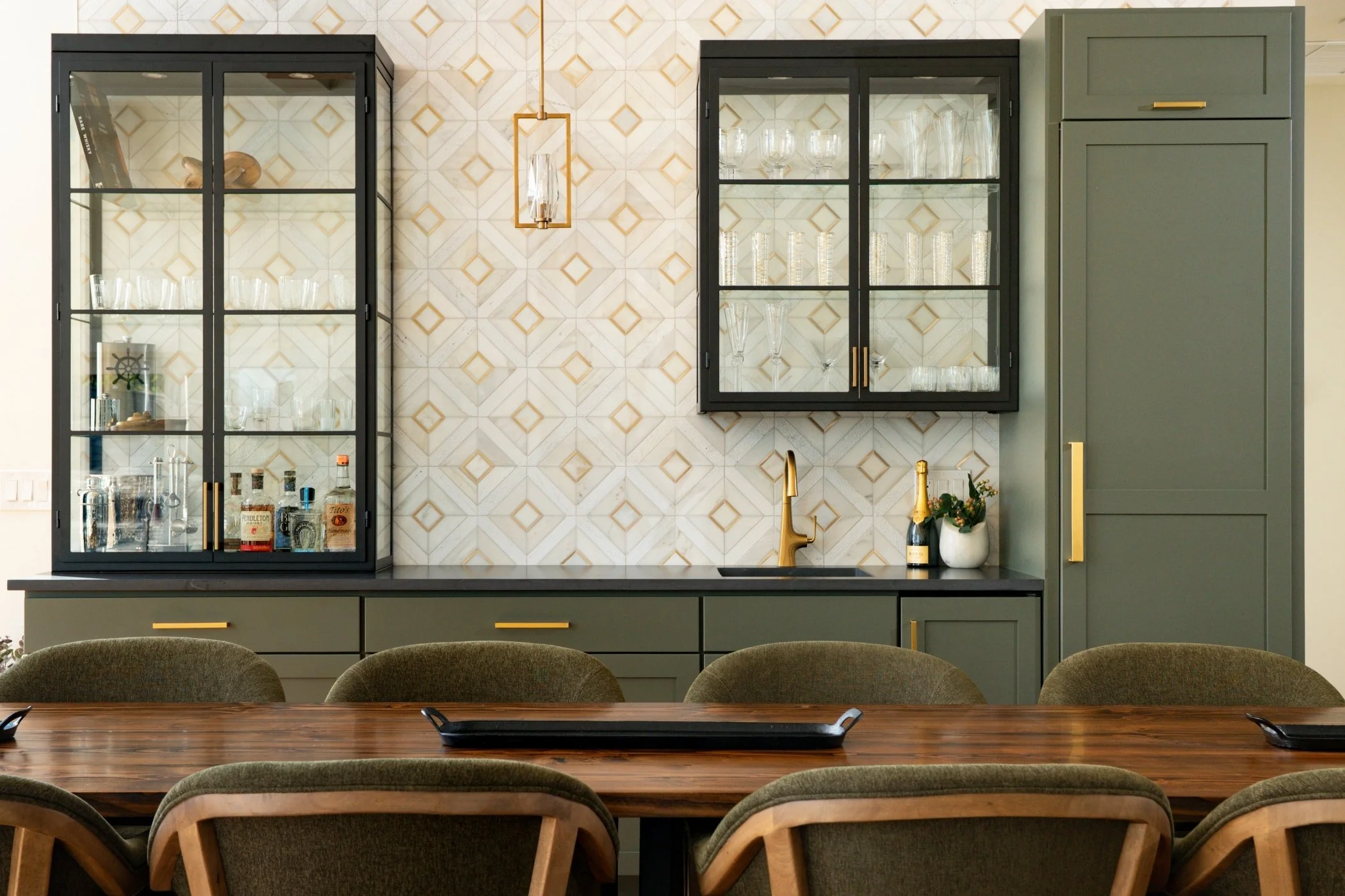 Custom whiskey and champagne bar with metal and glass cabinetry designed by HC Spec + Design in Olympia, WA